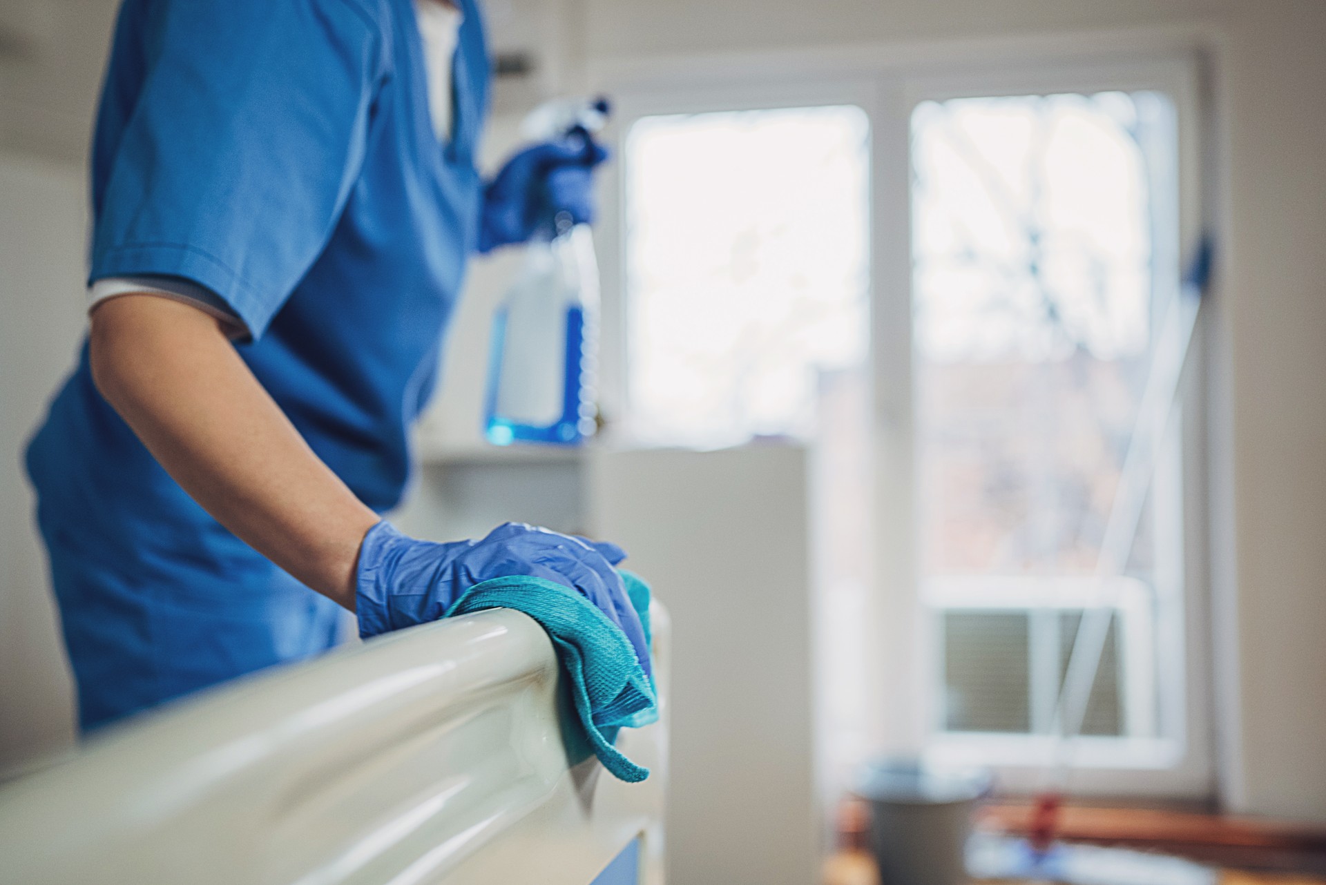 Nurse cleaning hospital ward